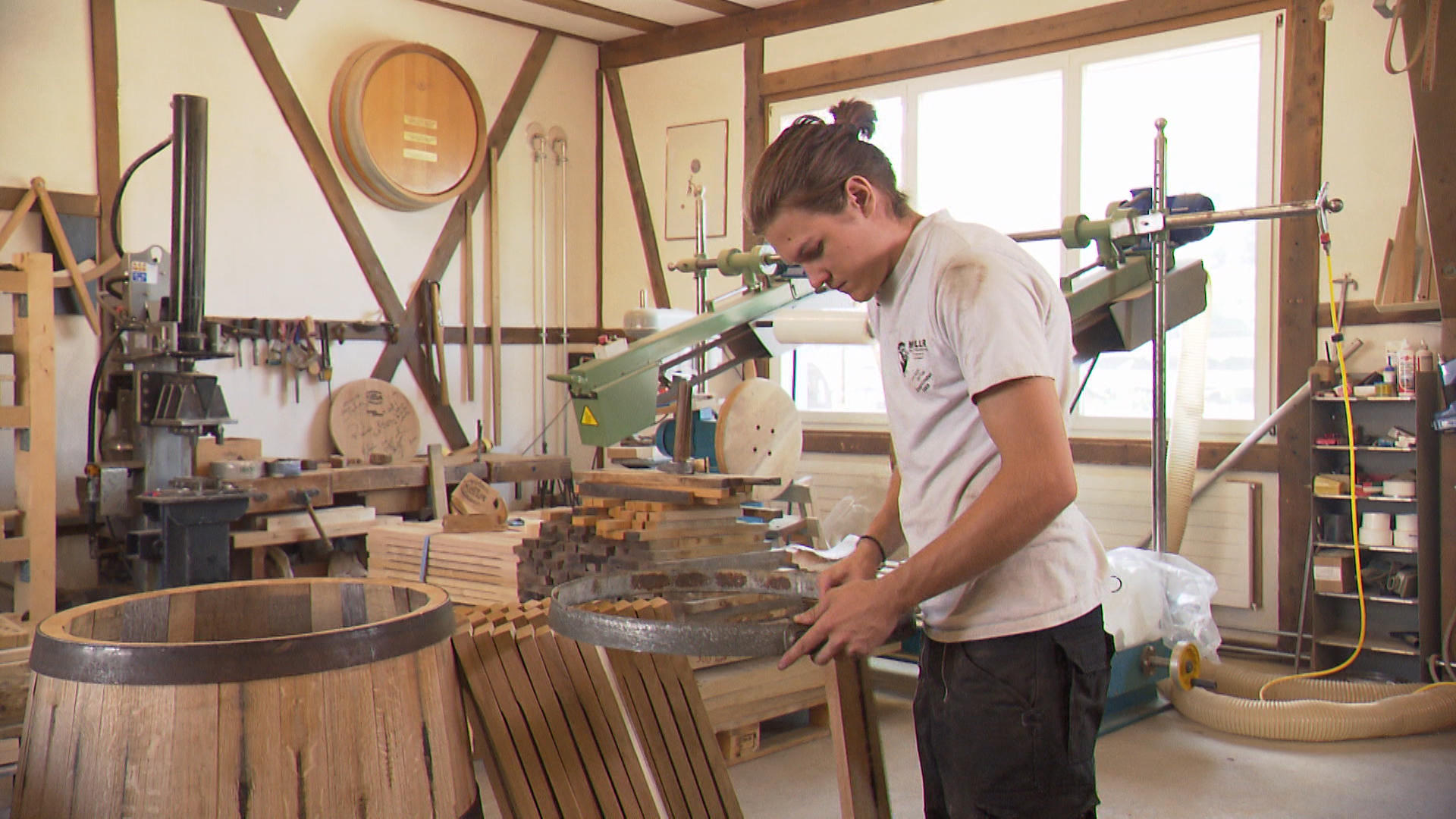 A young man who works in a carpenter s workshop.