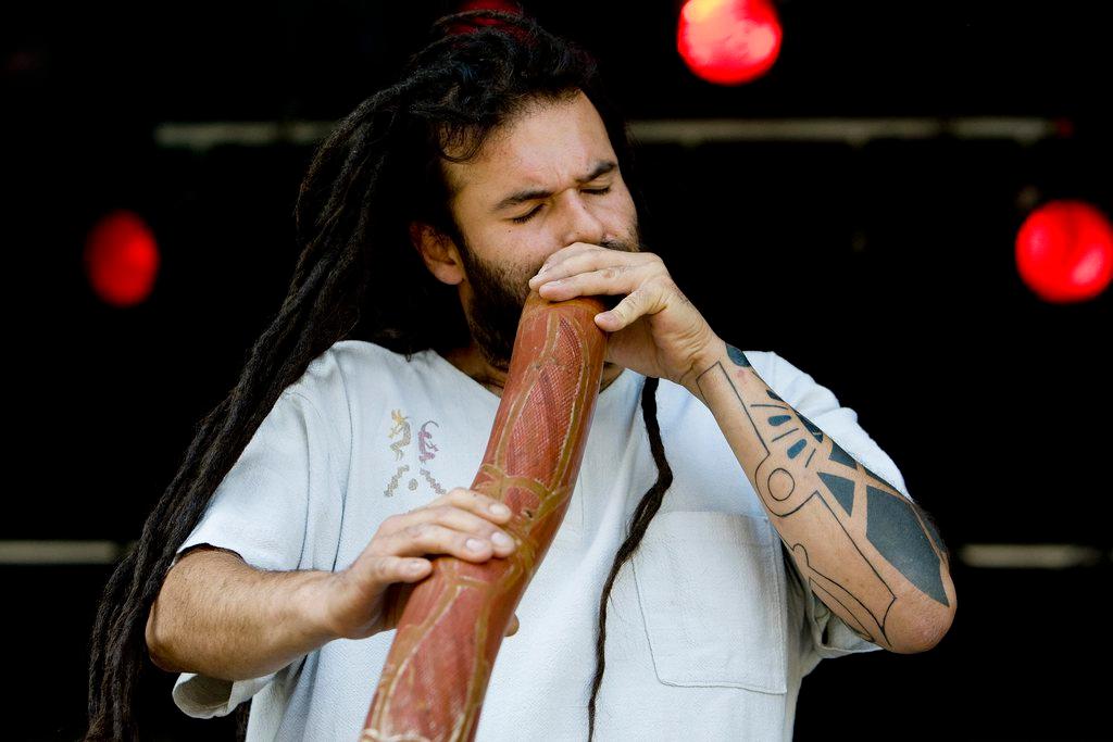 man playing didgeridoo
