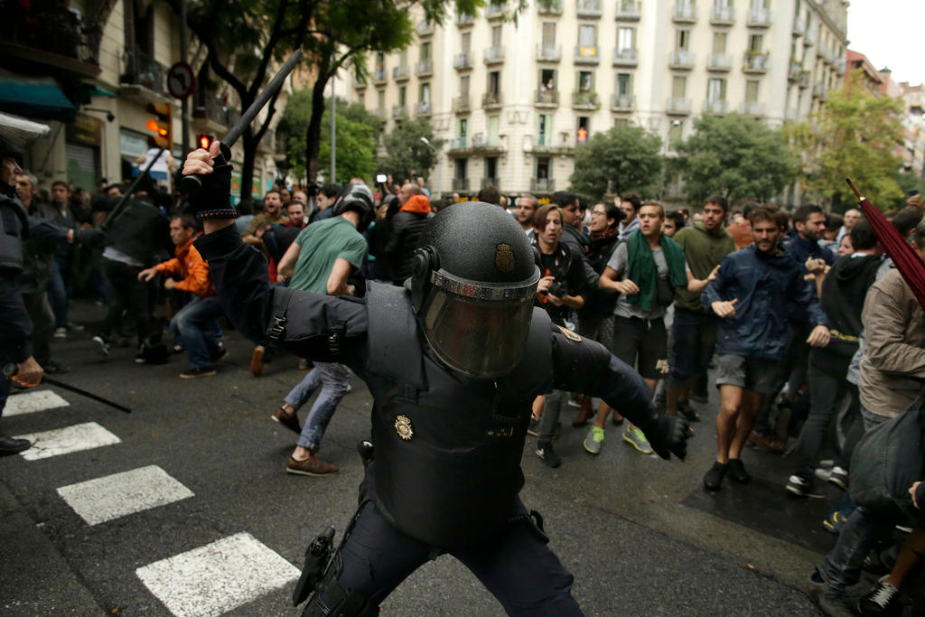 policeman with truncheon held in the air