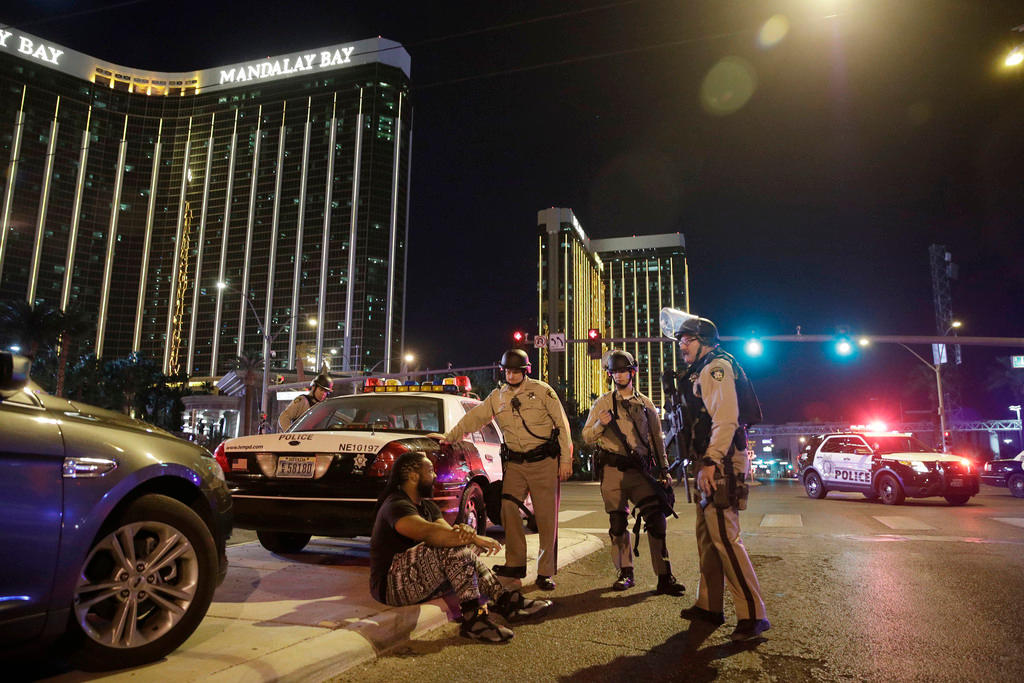 Officers stand outside Mandalay Hotel where mass shooting took place in Las Vegas.