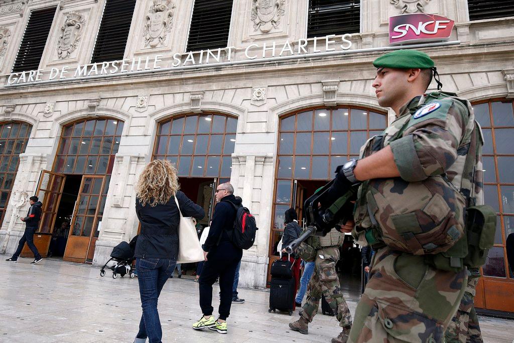 A French soldier patrols in front of Marseille train station