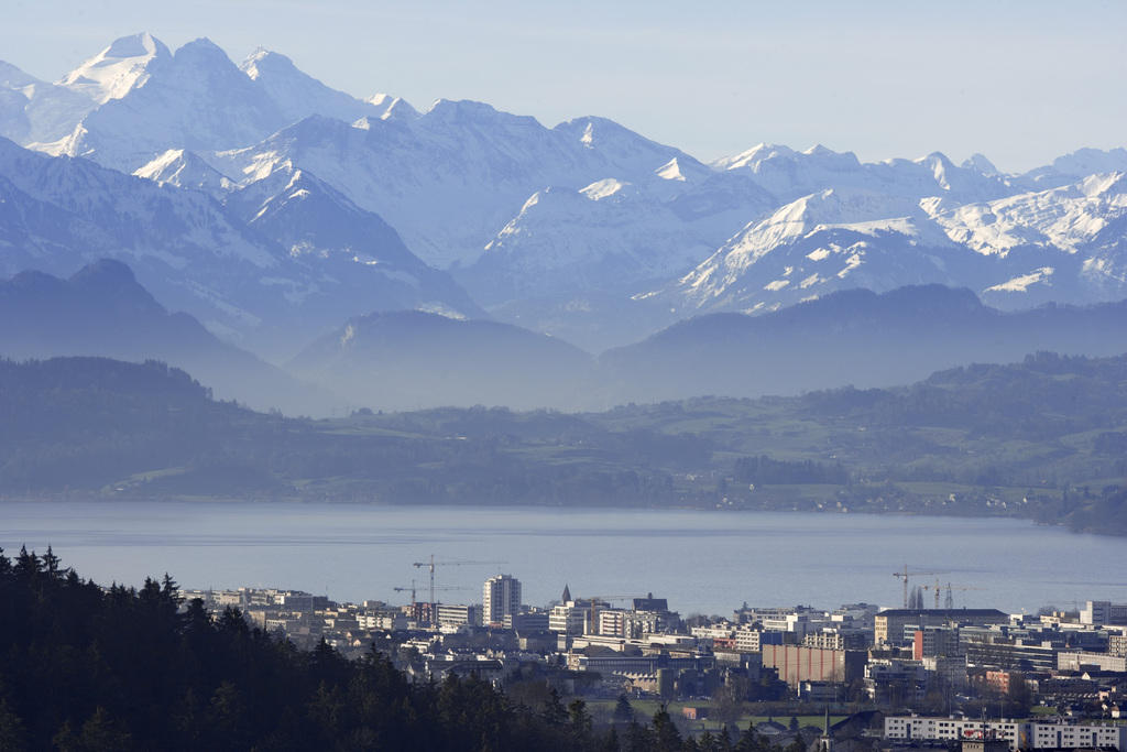 The town of Zug framed by mountains