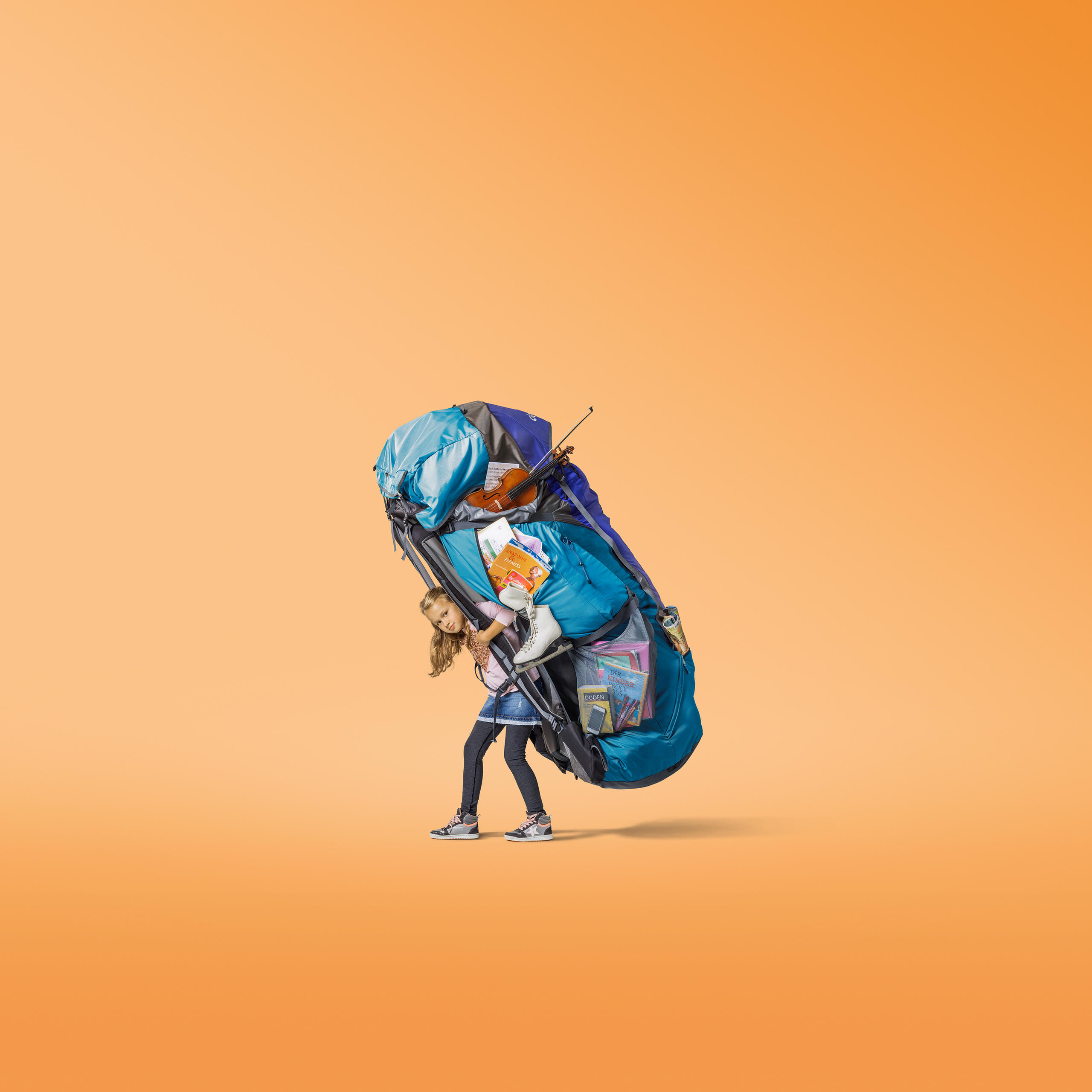 Child carrying heavy rucksack