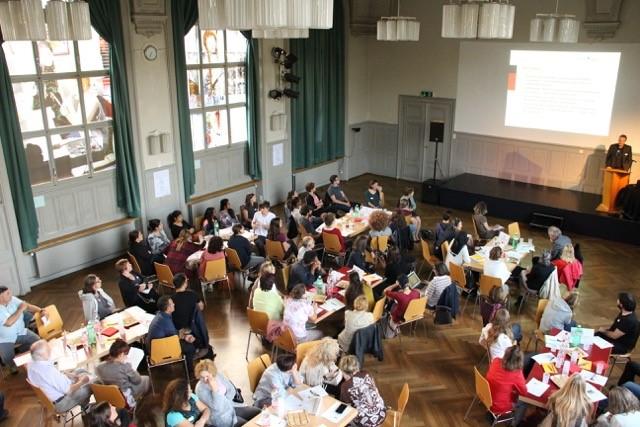 People listening to a presentation in Bern