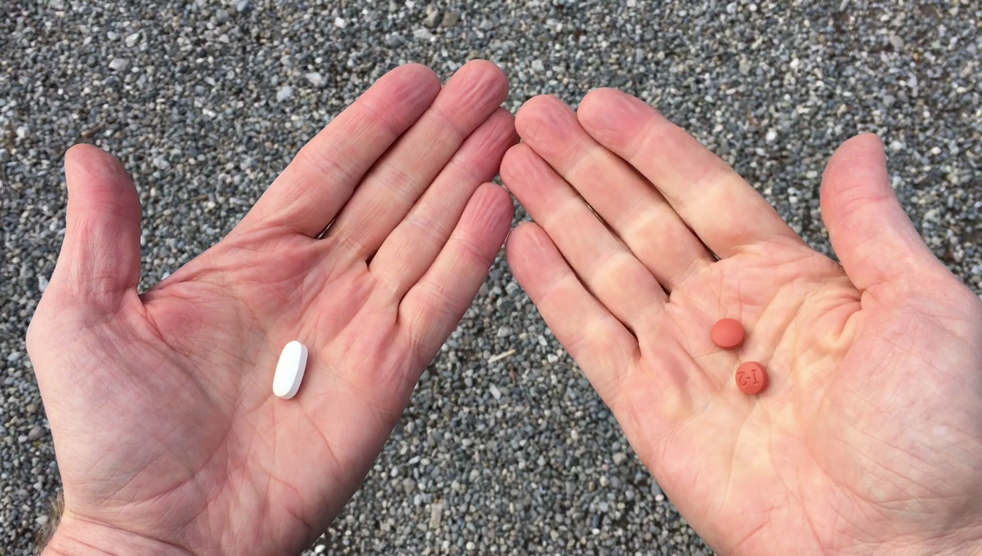 Hands holding pills
