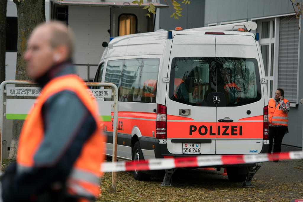 A policeman and police van in front of the mosque