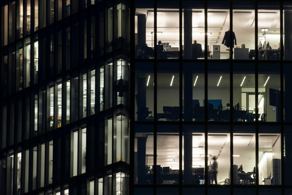 people working in office at night