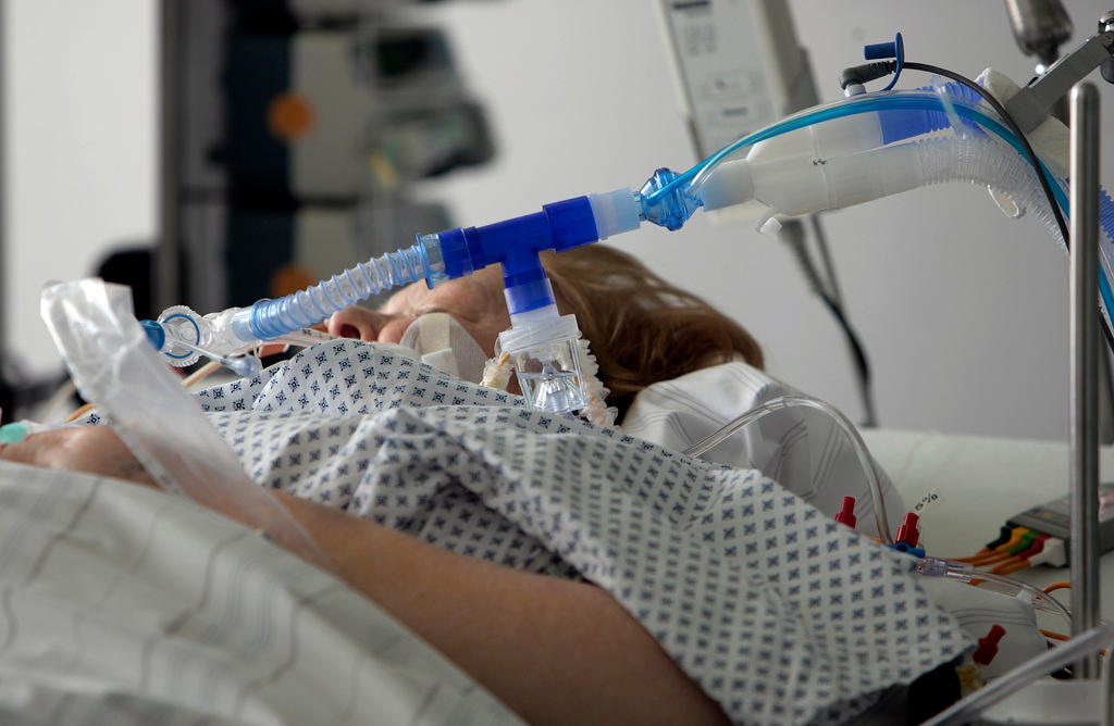 A patient lying in a hospital bed
