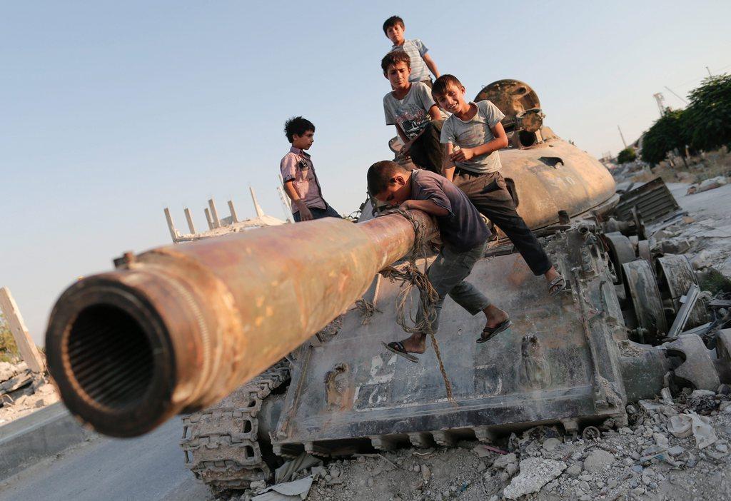 Kobane broken tank with kids playing on it