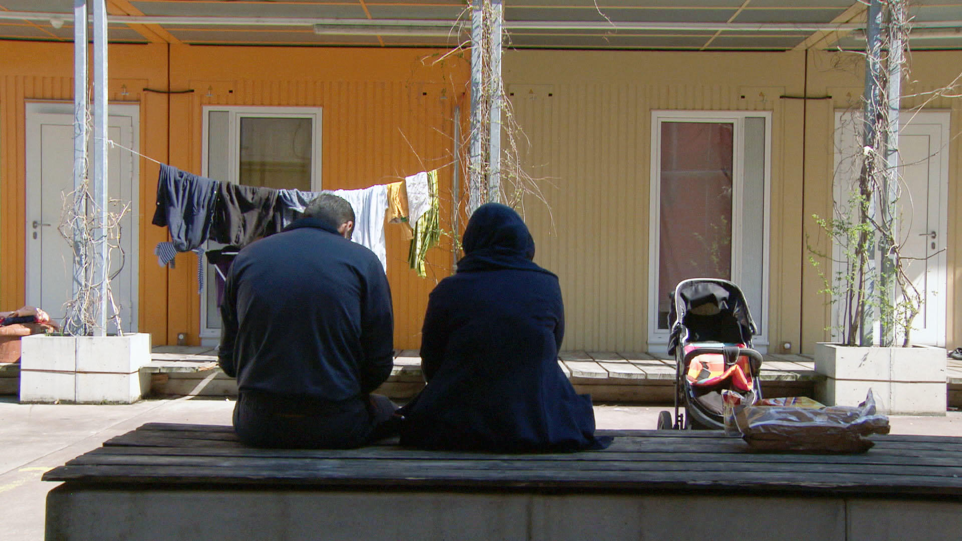 Two people sitting on a bench