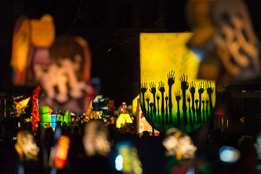 Revellers wearing lanterns parade through the streets at the carnival procession of Basel.