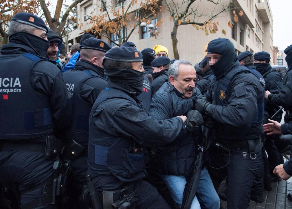 Demonstrators scuffle with members of the Catalonian regional police in Lleida