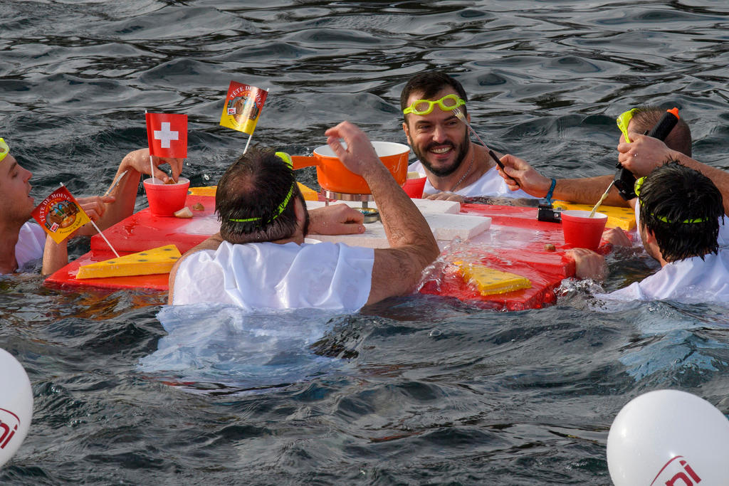 People eating fondue during Geneva Christmas swim