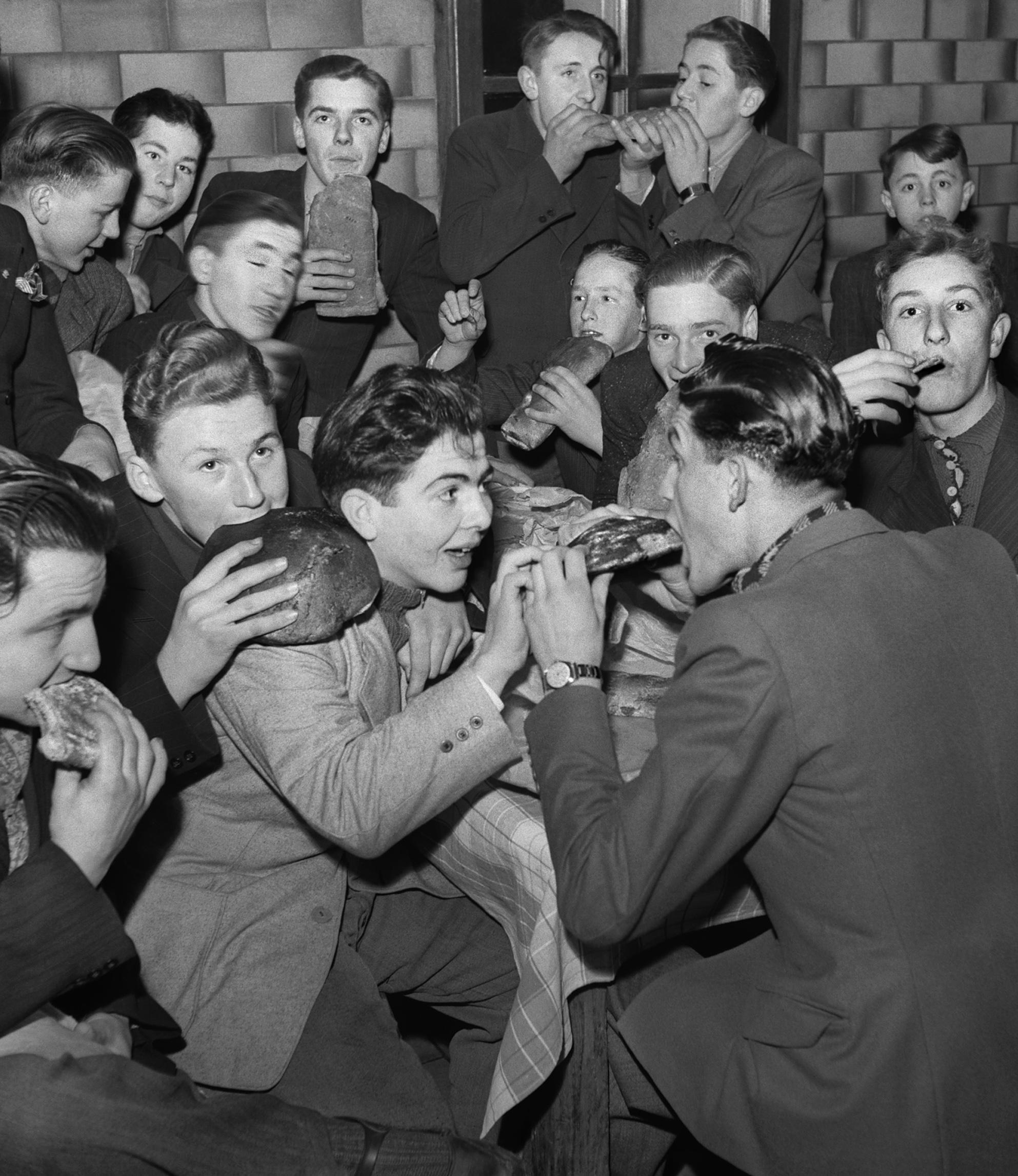 Men eating bread