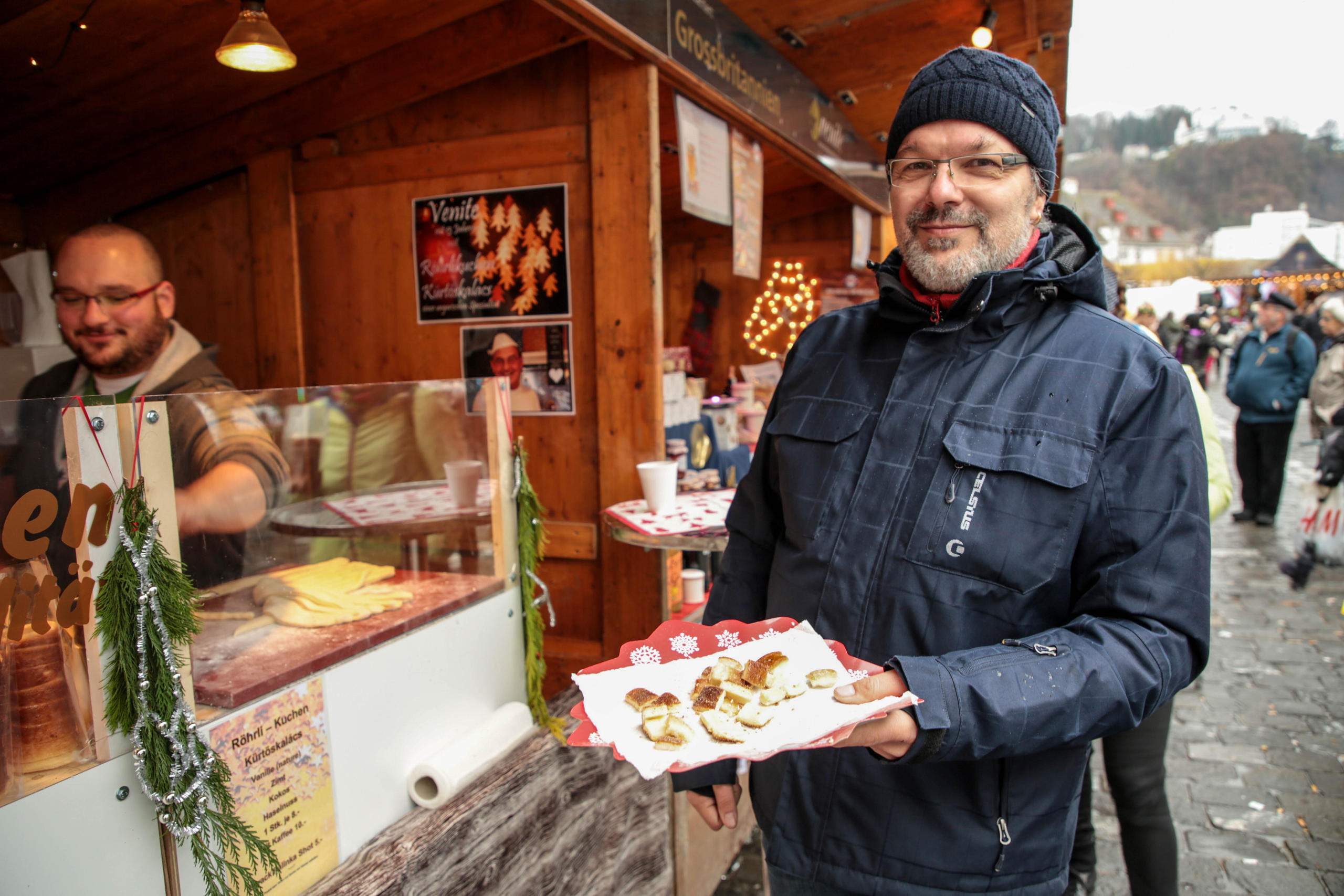 Man holding plate of Hungarian cake