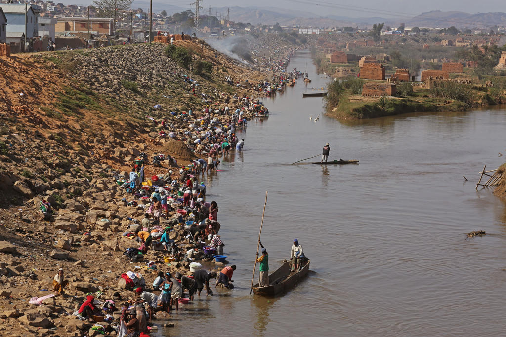 Hundreds of women wash their clothes in a Madagascar river