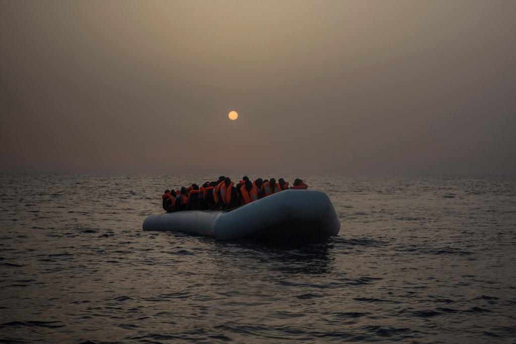 people in overloaded boat