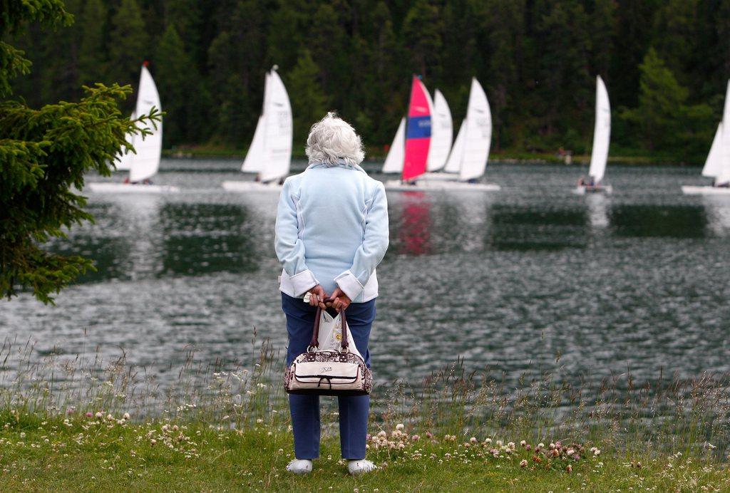 An old woman at the lake
