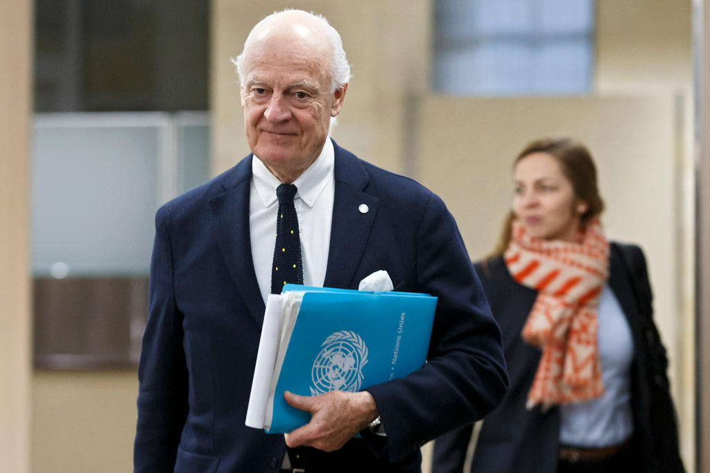 diplomat with UN file followed by woman