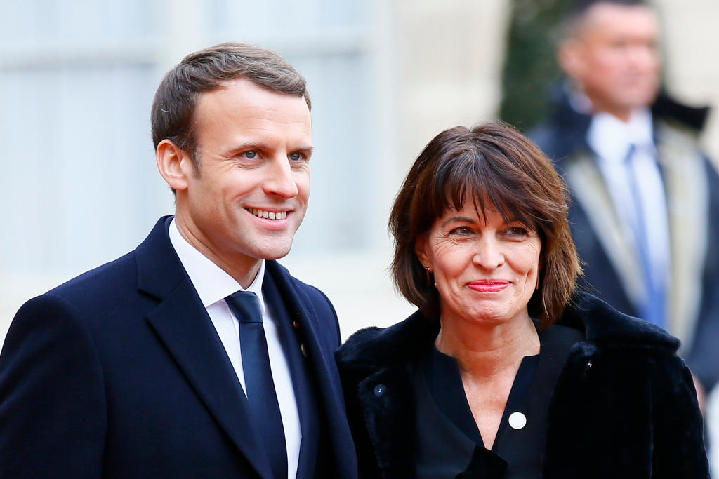 Swiss President Doris Leuthard is welcomed by French President Emmanuel Macron before a lunch in Paris on Dec. 12, 2017