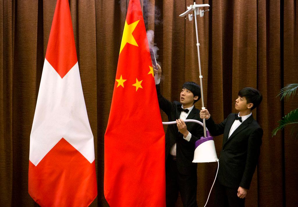 Chinese and Swiss flags
