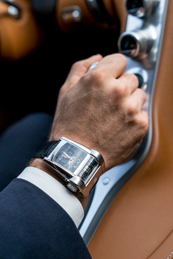 A close-up of a man wearing a Swiss watch
