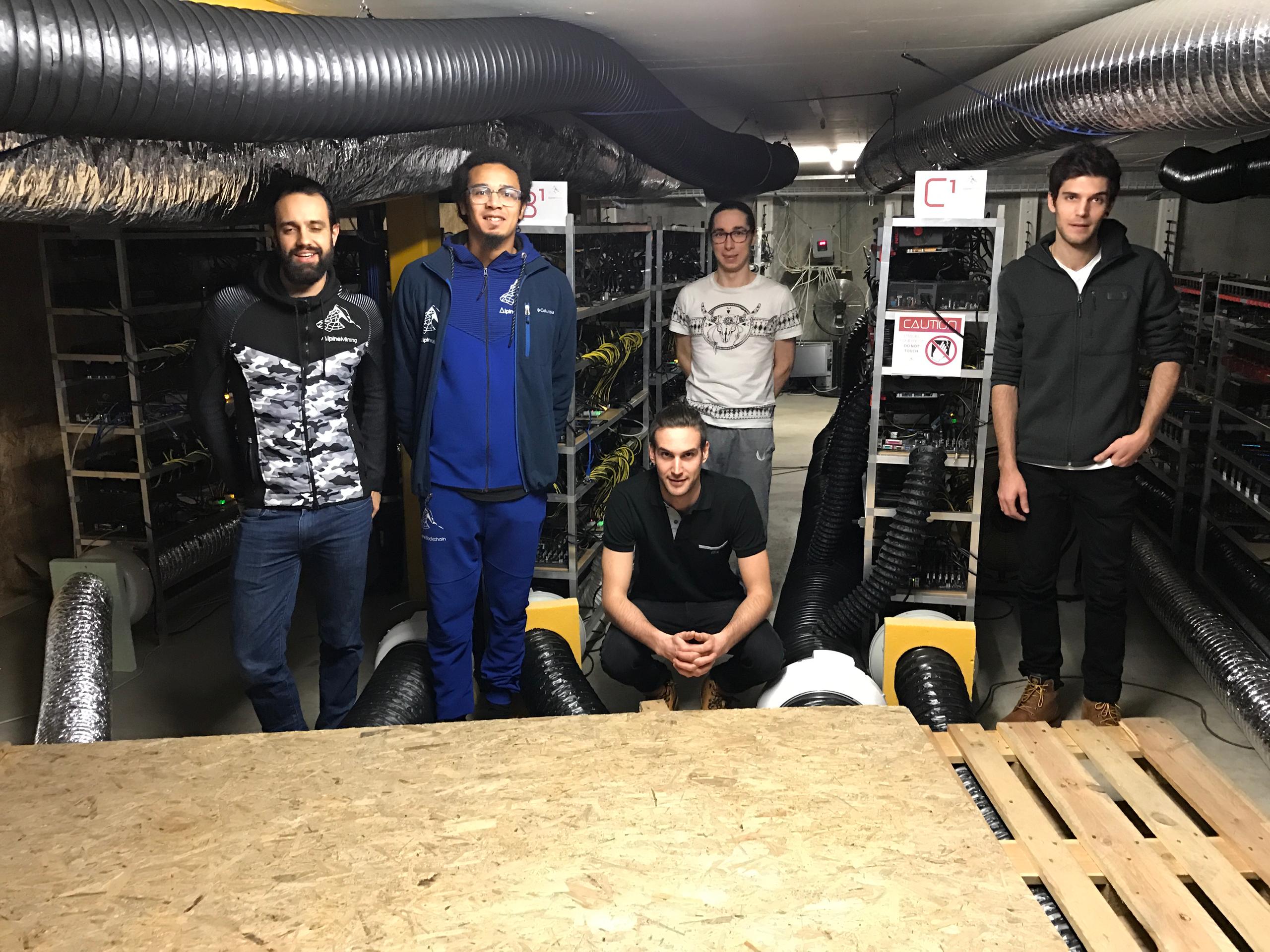 The Alpine Mining team pose in the Gondo crypto mine