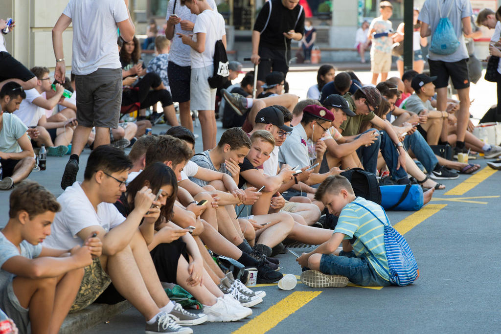 Young people playing pokemon go