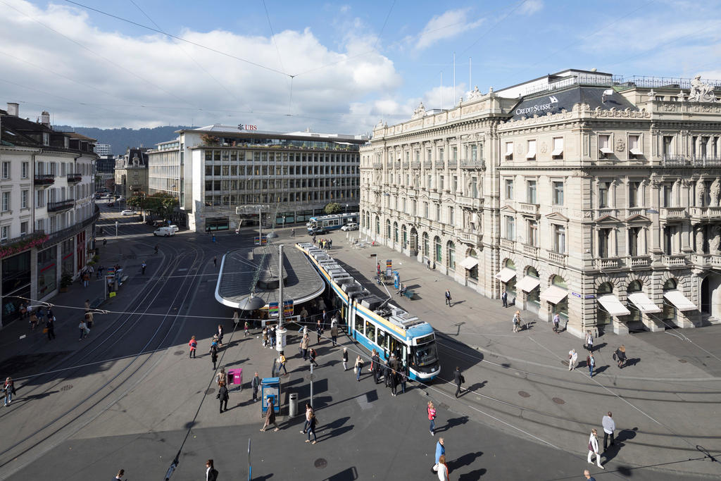 A tram stops in the midst of banks in Zurich s Paradeplatz