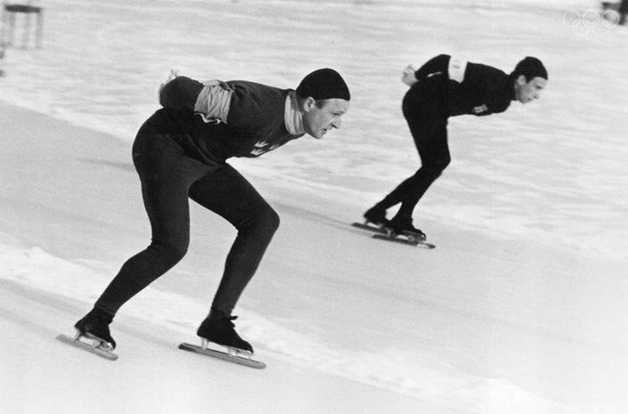 Two men speed skating at the 1948 Winter Olympics.