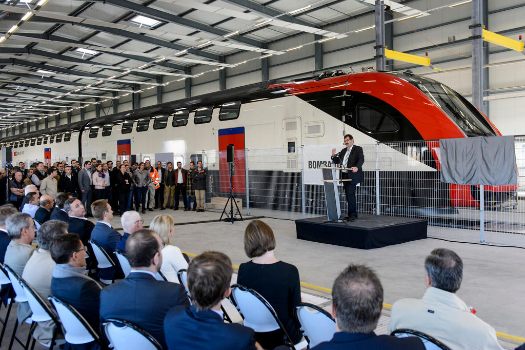 The Director of Bombardier giving a speech in front of a new train