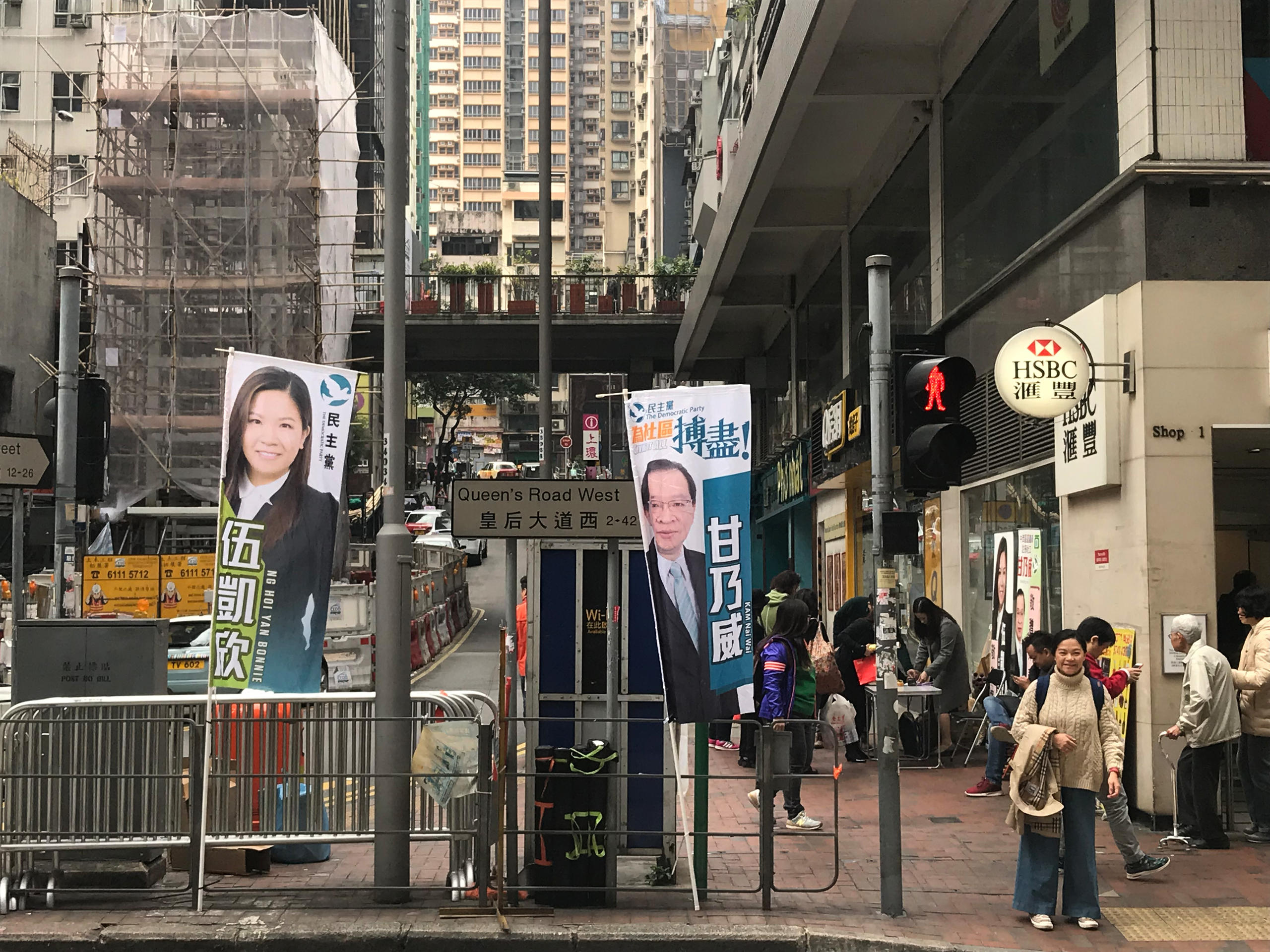 Street scene from Hong with posters of candidates in by-election