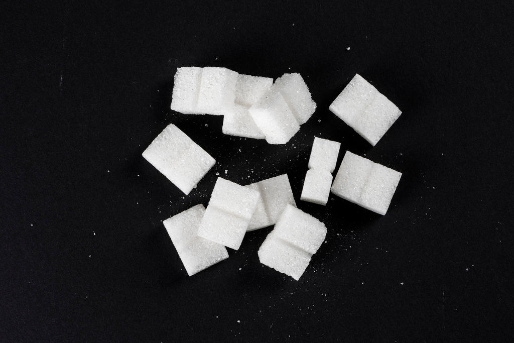 sugar cubes on black background