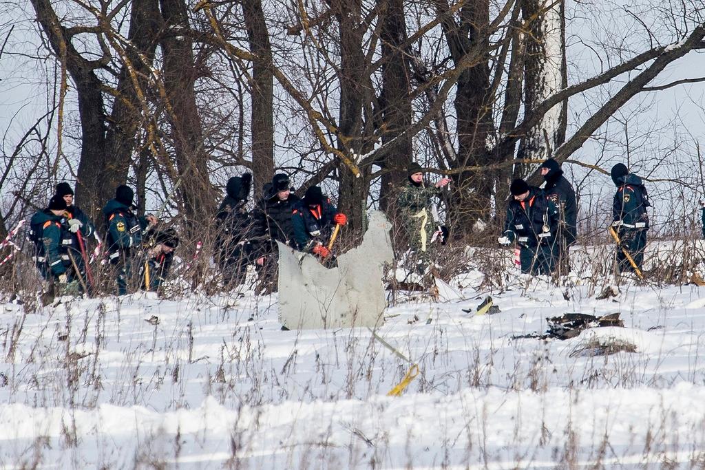 Emergency team work at the wreckage of Russian plane crash