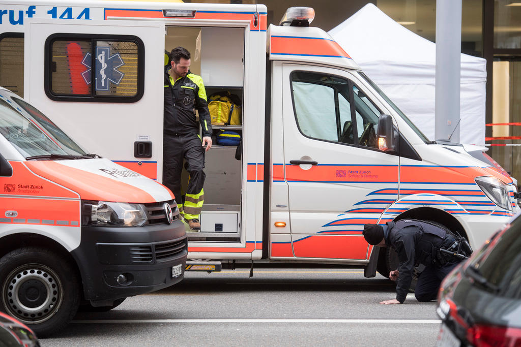 Ambulance car and policemen in streets of Zurich