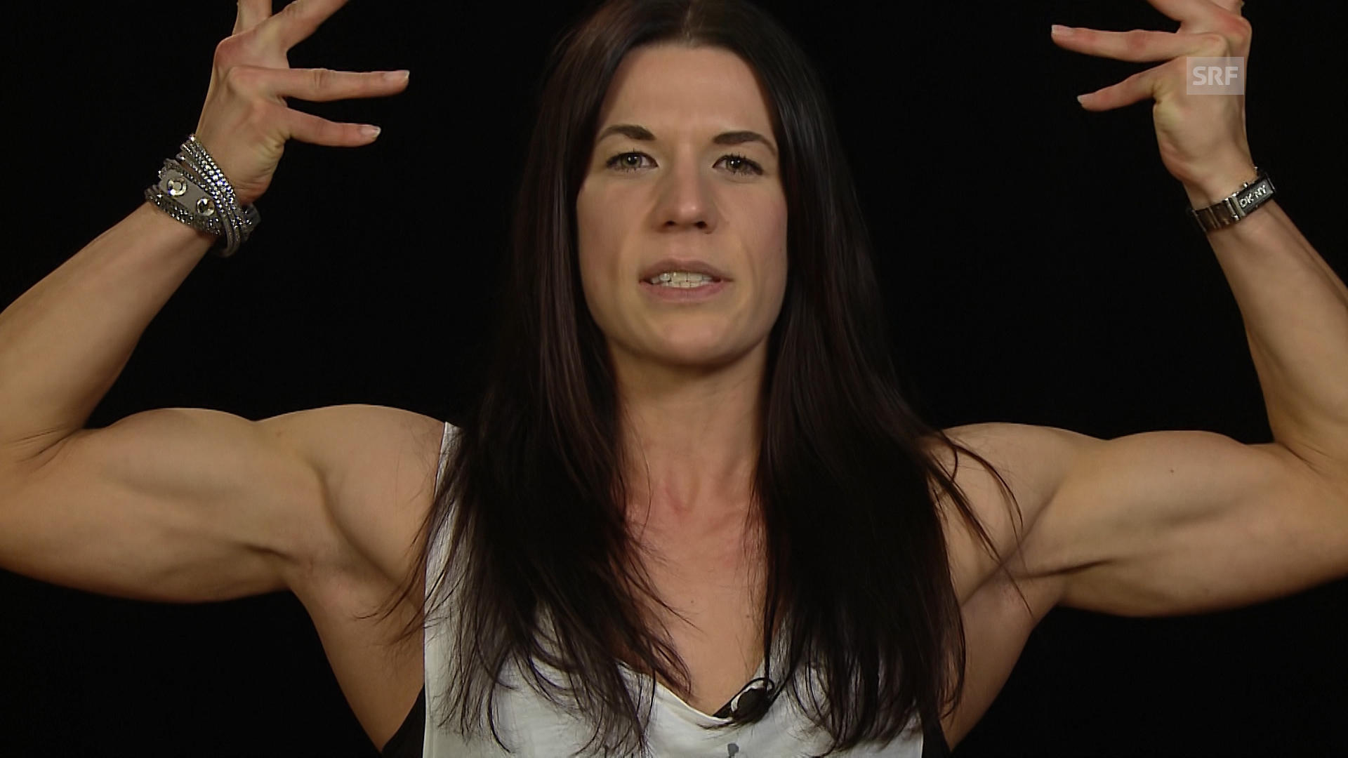 Anita flexing muscles