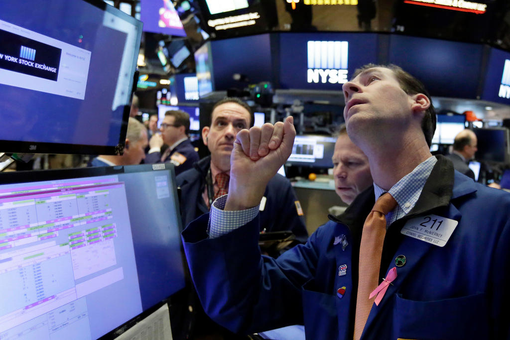 men and computer screens in New York stock exchange