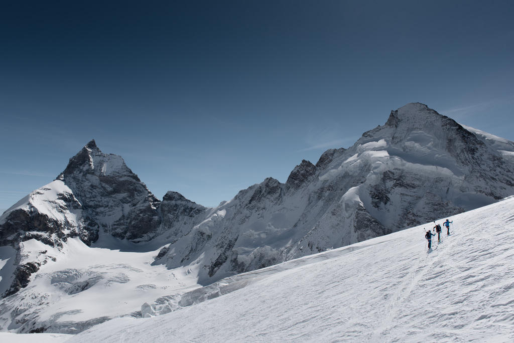 People hiking with skis