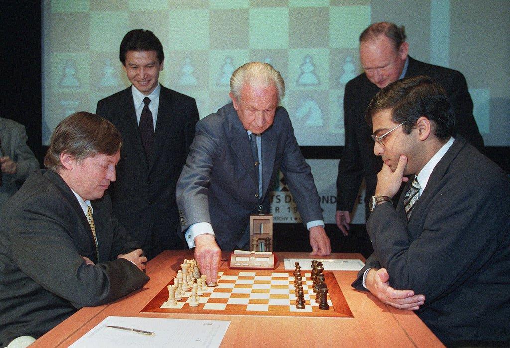 Four men around a chess borad