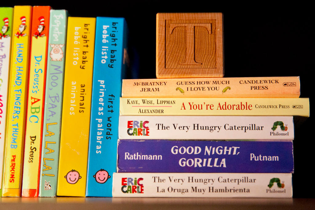 Children s books stacked on a shelf