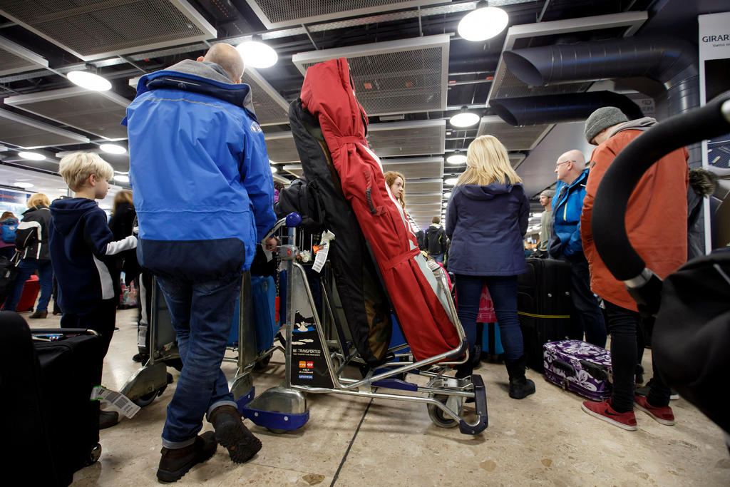 People waiting at Geneva airport