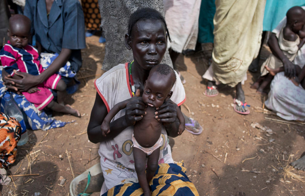 South Sudanese woman and baby in feeding centre