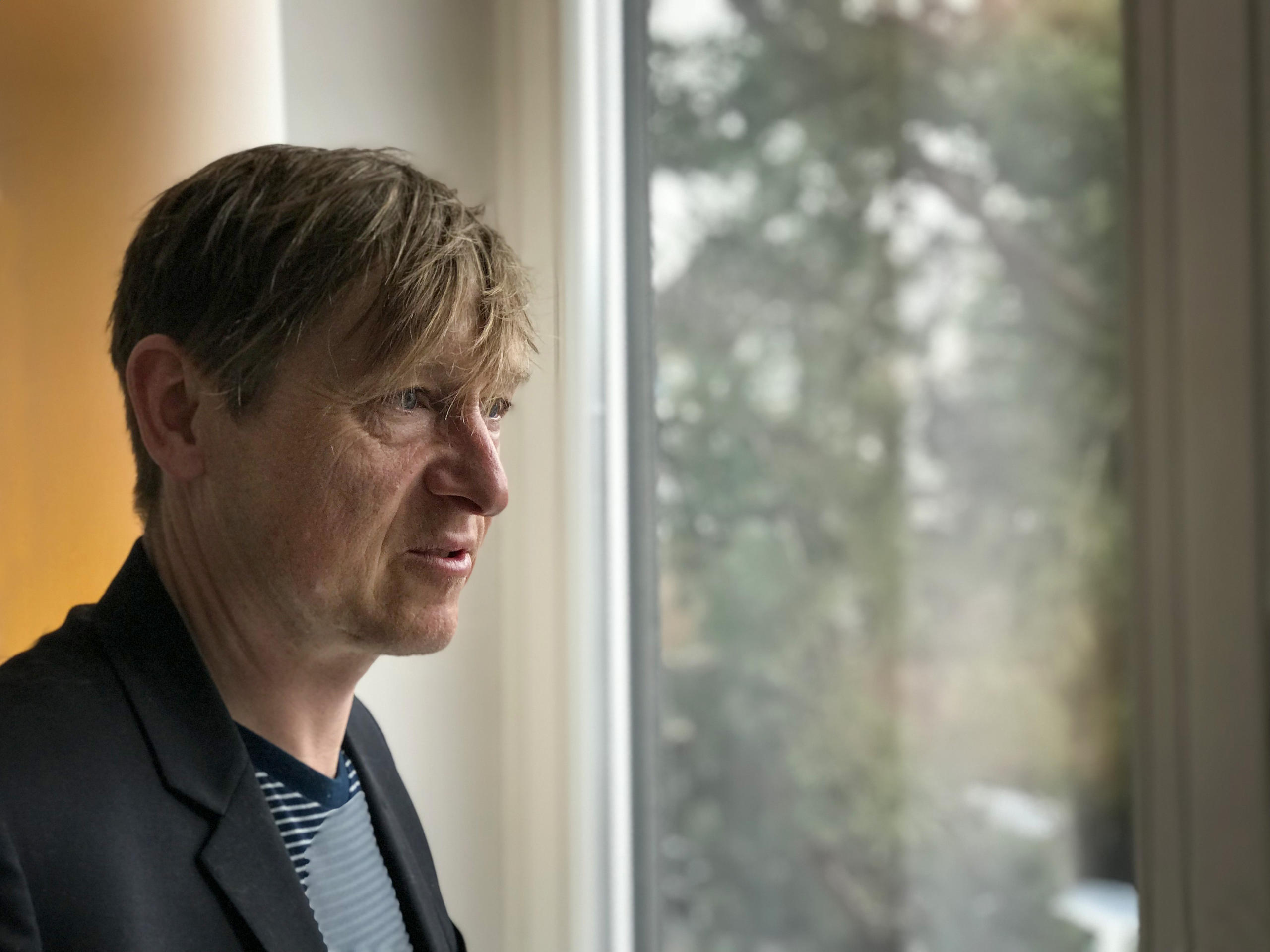 man at window