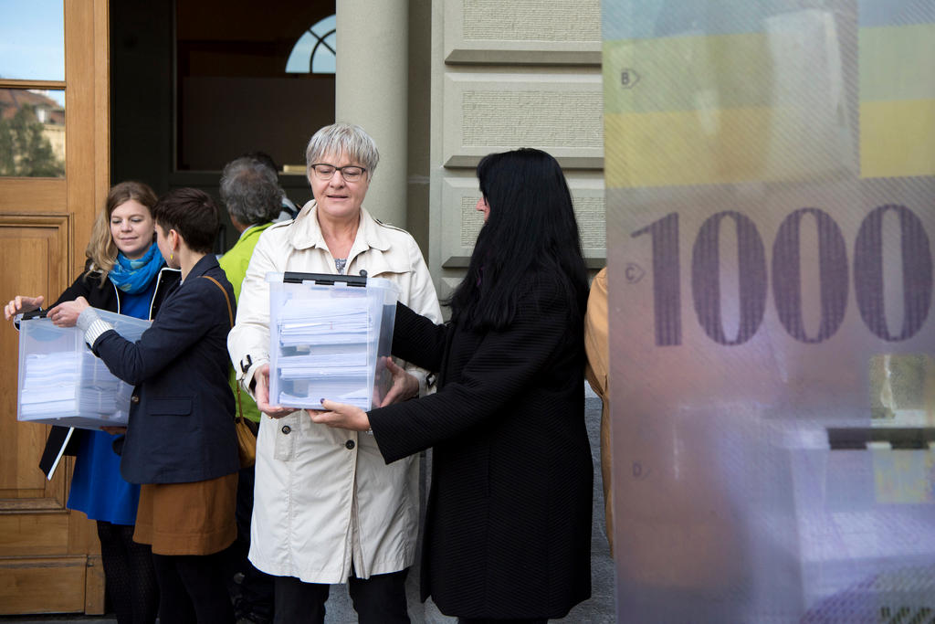 Campaigners handing signatures to the Federal Chancellery