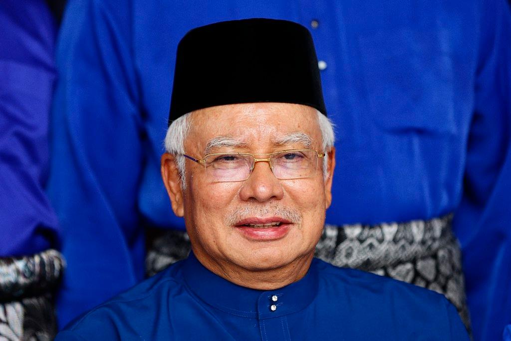 Malaysian Prime Minister, blue tunic, black hat