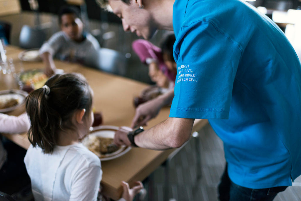 man feeding child