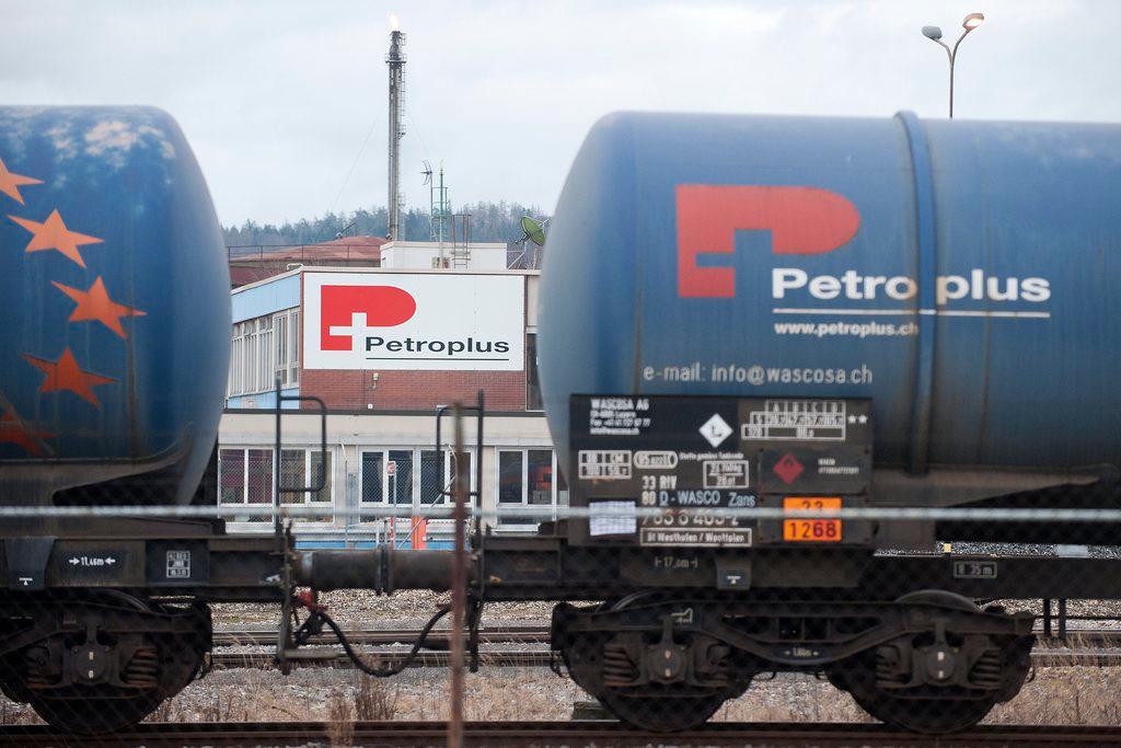 Petroplus rail containers in front of a refinery