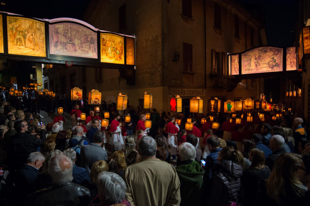 Inhabitants walk through the town