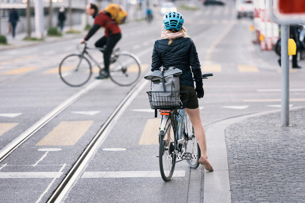 A woman on a bicycle on a street