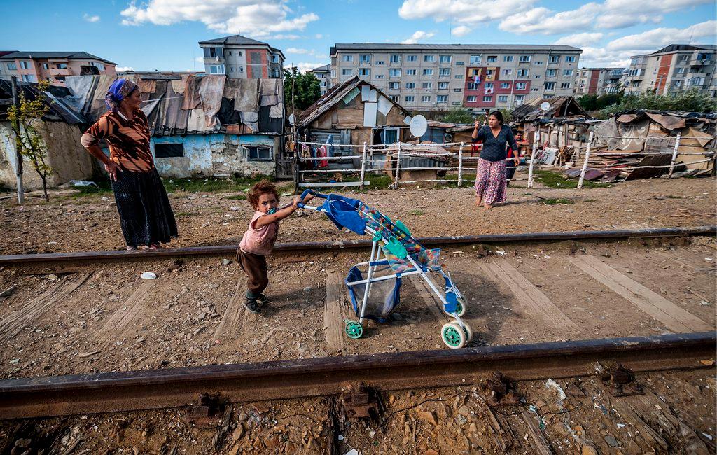 A picture of Roma people in a slum in Romania